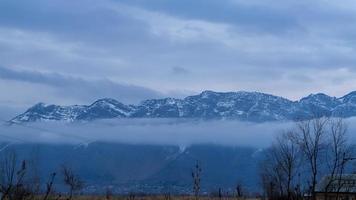 Foggy landscape in the mountains, High mountain in mist and cloud photo