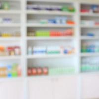 pharmacy shelves filled with medication blur background photo