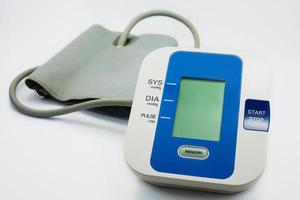 Digital Blood Pressure Monitor on white background photo