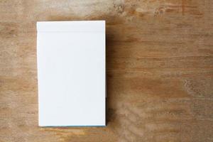 Blank paper on wood table photo