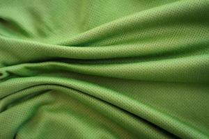 crumpled green fabric texture background photo
