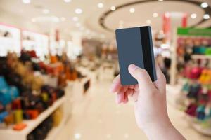 Female hand holding credit card photo