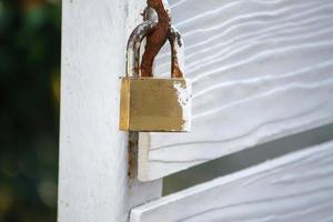 Closeup wood gate with lock photo