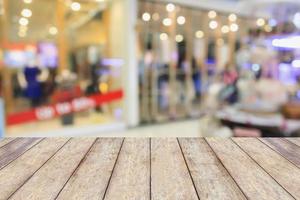 Empty table and blur clothing store with bokeh background photo