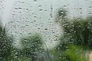 Natural water drops on glass photo