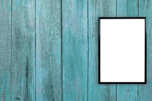 blank poster photo frame on wood wall