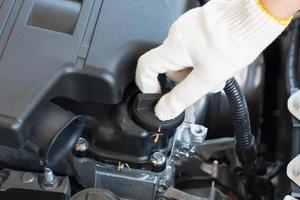 check the oil level in car engine photo