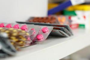 medicine pills on pharmacy shelf photo