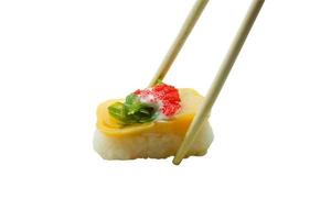 Sushi in chopsticks isolated on white background photo