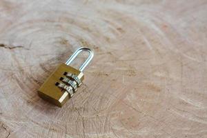 Close up pad lock on wooden background
