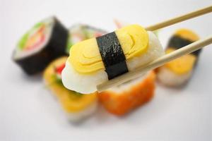 sushi with chopsticks photo