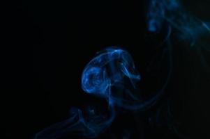 abstract background of smoke or fog on black background photo