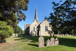 HORSTED KEYNES, UK, 2009. Steeplejack working church roof photo