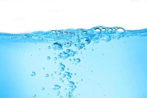 Blue surface water and air bubble isolated on white background photo