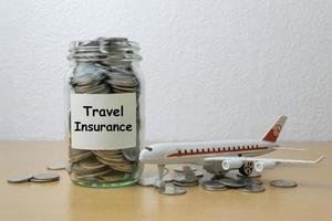 Money saving for travel Insurance in the glass bottle
