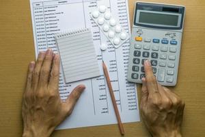 Man planning monthly budget, Finance about health concept photo