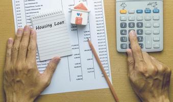 Man Planning monthly Housing loan photo