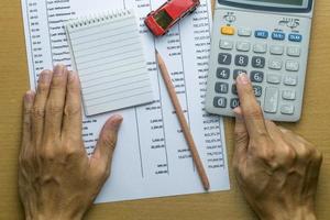Man planning monthly budget, Finance about car concept photo
