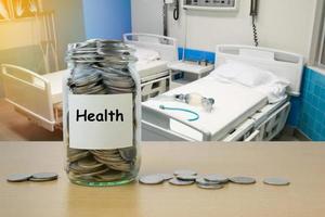 Money saving for Health expenses in the glass bottle photo