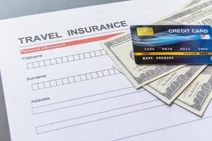 Travel  insurance form with model and policy document photo