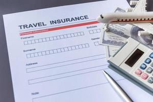 Travel  insurance form with model and policy document photo