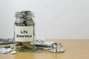 Money saving for life Insurance in the glass bottle photo