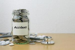 Money saving for Accident in the glass bottle photo