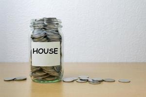 Money saving for house in the glass bottle photo