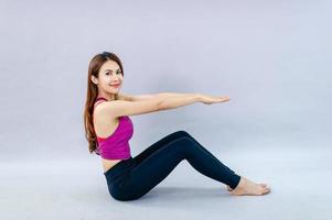 Women doing yoga for health Exercise in the room Concept of health care and good shape photo