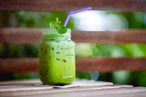 Iced green tea on the table, ready to drink Food and beverage concepts photo