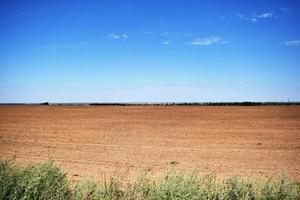 plowed field before sowing in sunny weather photo