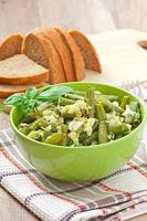 String beans with eggs in bowl. photo