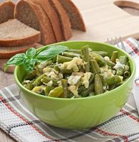 String beans with eggs in bowl. photo
