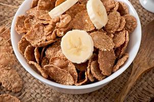 Healthy breakfast - whole grain muesli in a white bowl photo