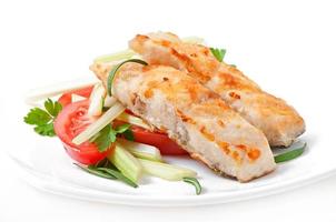 Fried filet fish and fresh vegetable salad photo