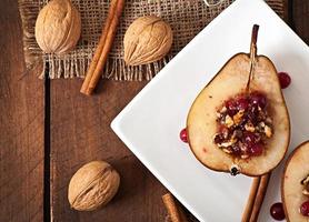 Baked pears with cranberries, honey and walnuts photo