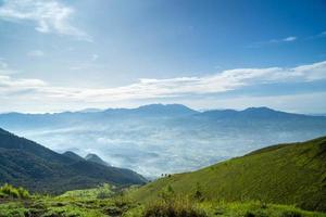 View of Indonesia's mountains with wide green grass photo