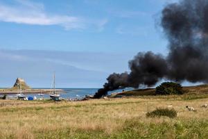 Fire on Holy Island of Lindisfarne Northumberland photo