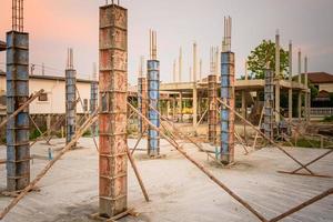 building process of a house column in construction site on housing project photo