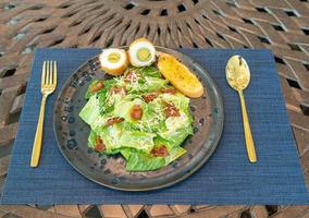 Fresh vegetable salad plate on table background photo