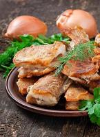 Fish dish - fried fish and herbs photo