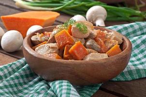 Stew chicken with vegetables and mushrooms in a cream sauce photo