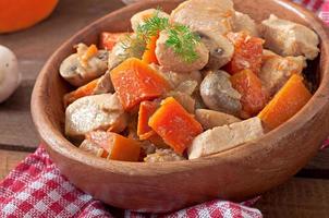 Stew chicken with vegetables and mushrooms in a cream sauce photo