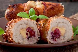 Chicken rolls with cranberries, cheese and honey photo