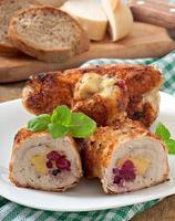 Chicken rolls with cranberries, cheese and honey photo