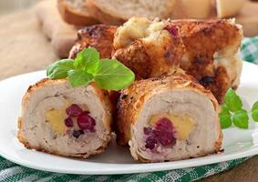 Chicken rolls with cranberries, cheese and honey photo