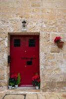 Bright colourful door way in a stone building