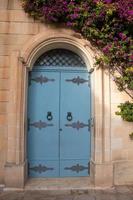 Bright colourful door way in a stone building photo