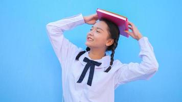 Happy school with book on blue background. photo