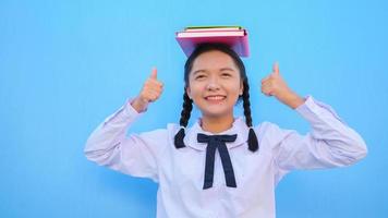 Happy school with book on blue background. photo